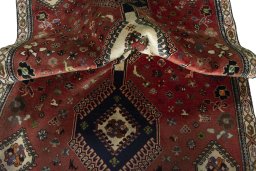Corner detail of 2000s Shiraz rug showing border pattern and Wool pile