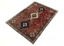Corner detail of 2000s Shiraz rug showing border pattern and Wool pile