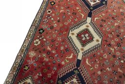 Backside of handmade 2000s Shiraz rug showing knot structure and weave density