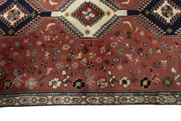 Close-up detail of 2000s Shiraz rug from Iran / Persia showing Wool weave