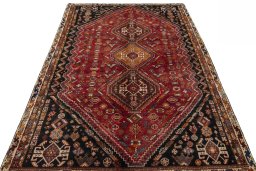 Surface texture of 2000s Shiraz rug with natural Wool and intricate pattern