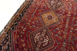 Backside of handmade 2000s Shiraz rug showing knot structure and weave density