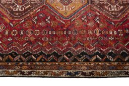 Full view of 2000s Shiraz rug from Iran / Persia, 283 × 180 cm in Red tones