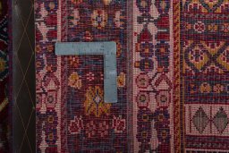Surface texture of 2000s Shiraz rug with natural Wool and intricate pattern