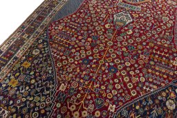 Backside of handmade 2000s Shiraz rug showing knot structure and weave density