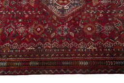 Full view of 1970s Shiraz rug from Iran / Persia, 272 × 174 cm in Red tones