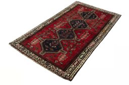 Corner detail of 2000s Shiraz rug showing border pattern and Wool pile