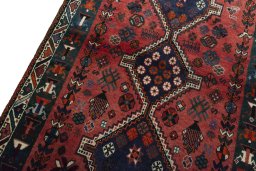 Backside of handmade 2000s Shiraz rug showing knot structure and weave density