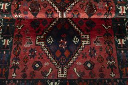 Full view of 2000s Shiraz rug from Iran / Persia, 173 × 108 cm in Red tones