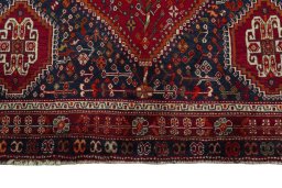 Full view of 1970s Shiraz rug from Iran / Persia, 254 × 167 cm in Red tones