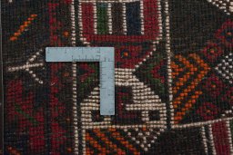 Backside of handmade 2000s Shiraz rug showing knot structure and weave density