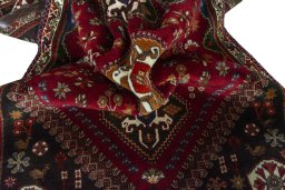Corner detail of 2000s Shiraz rug showing border pattern and Wool pile