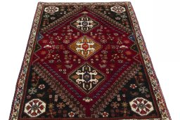Surface texture of 2000s Shiraz rug with natural Wool and intricate pattern