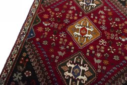 Backside of handmade 2000s Shiraz rug showing knot structure and weave density