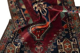 Corner detail of 2000s Shiraz rug showing border pattern and Wool pile