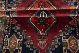Full view of 2000s Shiraz rug from Iran / Persia, 227 × 125 cm in Red tones