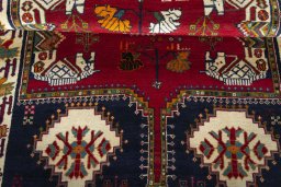 Corner detail of 2000s Shiraz rug showing border pattern and Wool pile