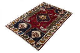 Corner detail of 2000s Shiraz rug showing border pattern and Wool pile
