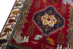 Backside of handmade 2000s Shiraz rug showing knot structure and weave density