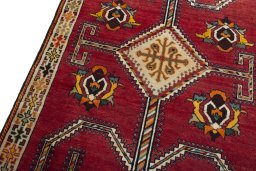 Backside of handmade 2000s Shiraz rug showing knot structure and weave density