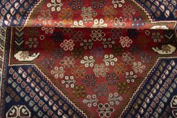 Corner detail of 2000s Shiraz rug showing border pattern and Wool pile