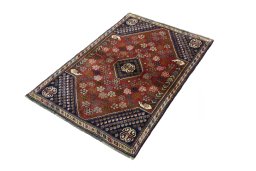 Corner detail of 2000s Shiraz rug showing border pattern and Wool pile