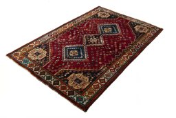 Corner detail of 2000s Shiraz rug showing border pattern and Wool pile