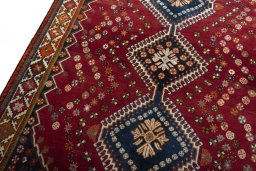 Backside of handmade 2000s Shiraz rug showing knot structure and weave density