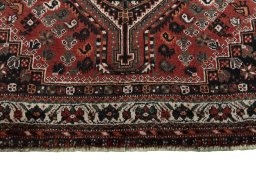 Central medallion detail of 2000s Shiraz rug from Iran / Persia