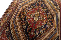 Backside of handmade 2000s Shiraz rug showing knot structure and weave density