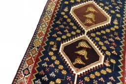 Backside of handmade 2000s Shiraz rug showing knot structure and weave density