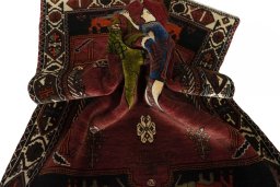 Corner detail of 2000s Shiraz rug showing border pattern and Wool pile