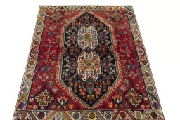 Surface texture of 2000s Shiraz rug with natural Wool and intricate pattern