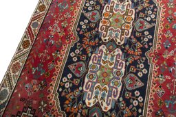 Backside of handmade 2000s Shiraz rug showing knot structure and weave density