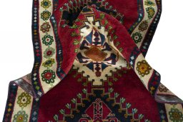 Corner detail of 2000s Shiraz rug showing border pattern and Wool pile