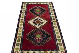 Surface texture of 2000s Shiraz rug with natural Wool and intricate pattern