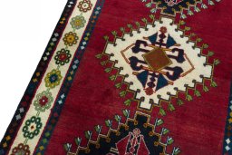 Backside of handmade 2000s Shiraz rug showing knot structure and weave density
