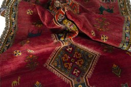 Corner detail of 2000s Shiraz rug showing border pattern and Wool pile