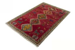 Corner detail of 2000s Shiraz rug showing border pattern and Wool pile