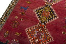 Backside of handmade 2000s Shiraz rug showing knot structure and weave density