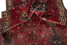 Corner detail of 1970s Shiraz rug showing border pattern and Wool pile