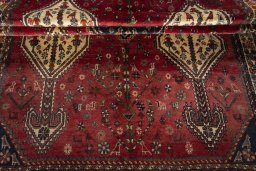Full view of 1970s Shiraz rug from Iran / Persia, 300 × 155 cm in Red tones
