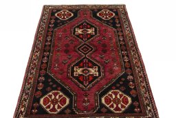 Surface texture of 2000s Shiraz rug with natural Wool and intricate pattern