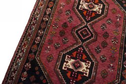 Backside of handmade 2000s Shiraz rug showing knot structure and weave density