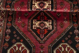 Full view of 2000s Shiraz rug from Iran / Persia, 174 × 111 cm in Red tones
