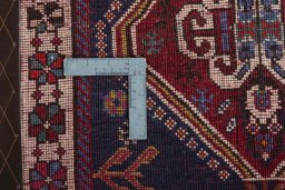 Surface texture of 2000s Shiraz rug with natural Wool and intricate pattern