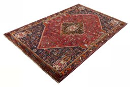Corner detail of 2000s Shiraz rug showing border pattern and Wool pile
