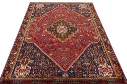 Surface texture of 2000s Shiraz rug with natural Wool and intricate pattern