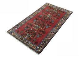 Corner detail of 2000s Shiraz rug showing border pattern and Wool pile