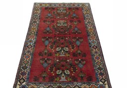Surface texture of 2000s Shiraz rug with natural Wool and intricate pattern
